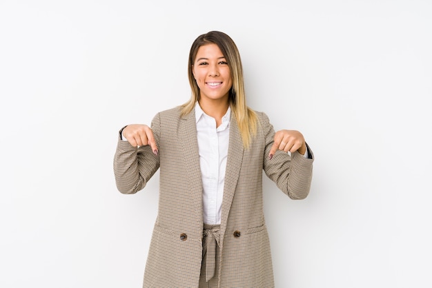 Young business woman isolated points down with fingers, positive feeling