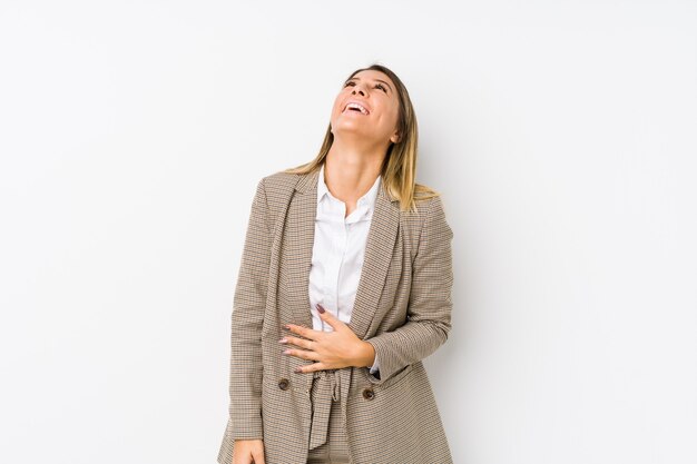 Young business woman isolated relaxed and happy laughing, neck stretched showing teeth