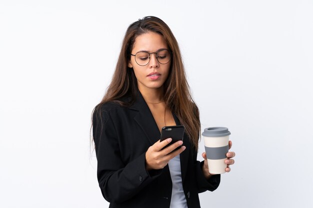 Young business woman over isolated wall