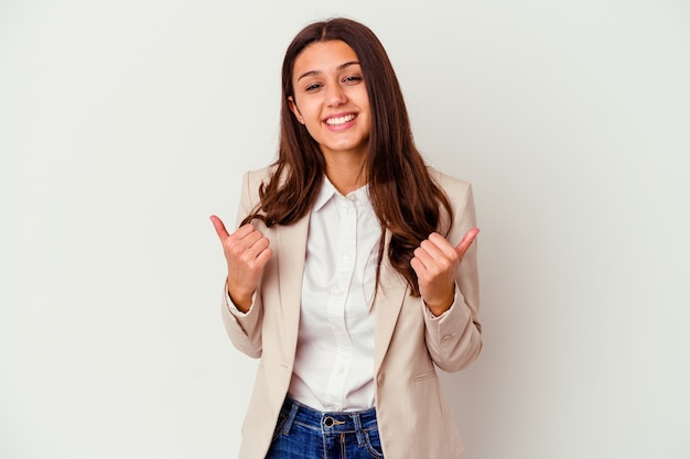 Young business woman isolated on white wall raising both thumbs up, smiling and confident