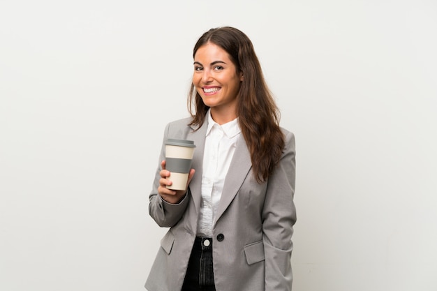 Young business woman over isolated white wall