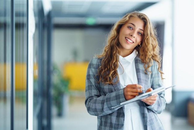 Young business woman an office building hallway Female Entrepreneur People business freelance