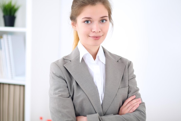 Young business woman in office. Successful business concept.