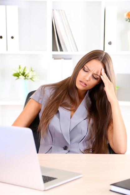 Young business woman in office