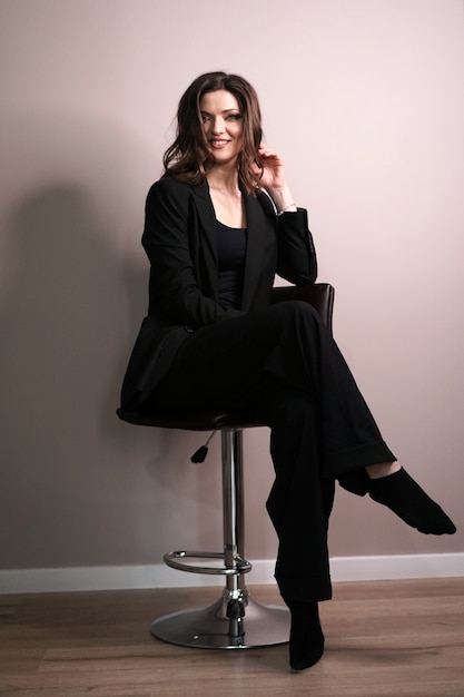 Young business woman sitting in chair