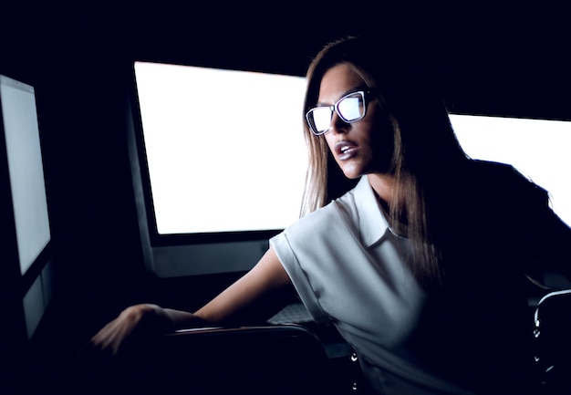 Young business woman sitting in computer room