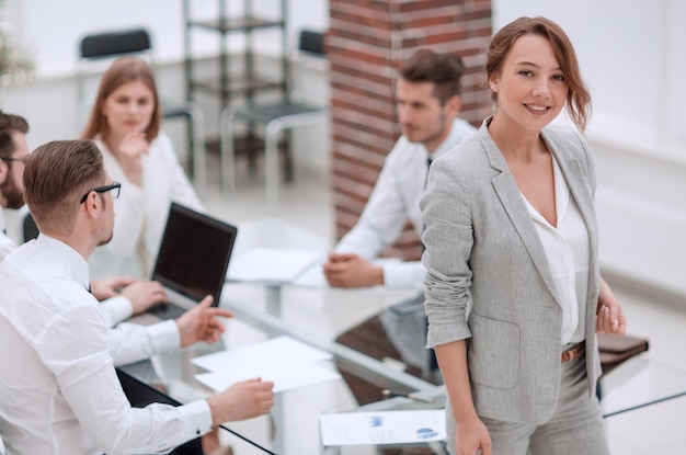 Young business woman standing in office