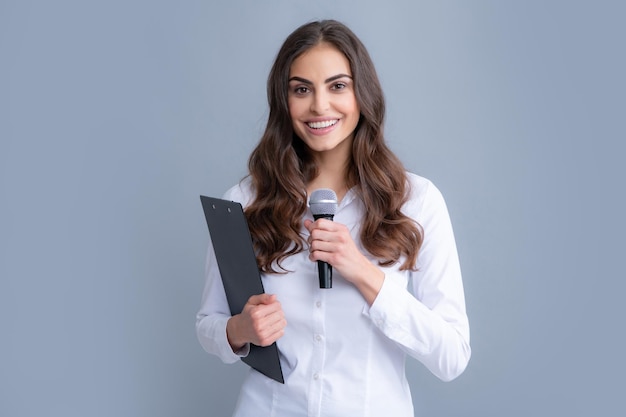 Young business woman talking with mic Woman talking with microphone Communication and information concept