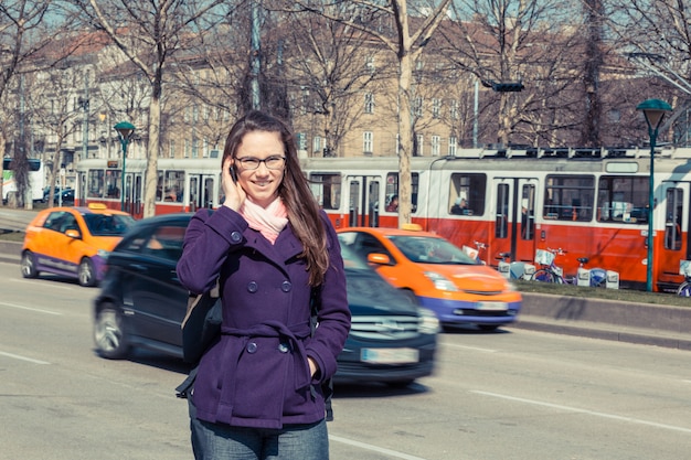 Young Business Woman next to Urban Road