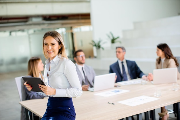 Young business woman with digital tablet in the office