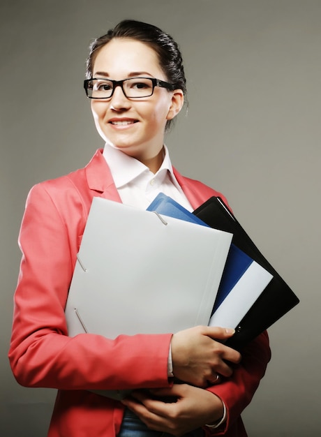 Young business woman with folders