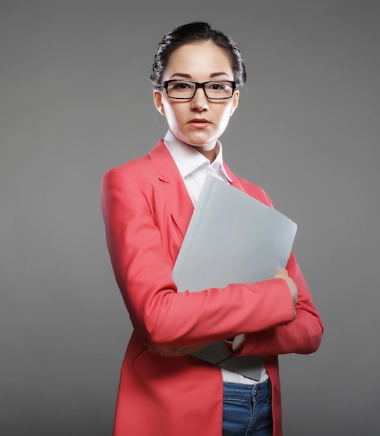 Young business woman with folders