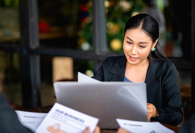 young business woman working intently and have a bright smile Meeting of the work plan financial planner finance staff happy work Financial and investment planner