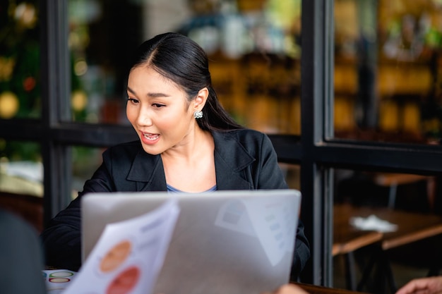 young business woman working intently and have a bright smile Meeting of the work plan financial planner finance staff happy work Financial and investment planner