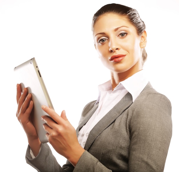 Young business woman working on tablet