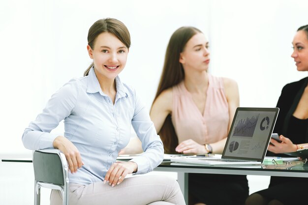 Young business woman working with marketing data in office