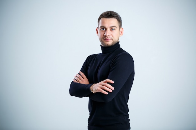 Young businessman in black golf and jeans