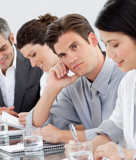 Young businessman bored at a presentation 