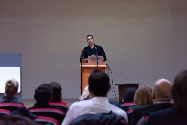young businessman at business conference room with public giving presentations audience at the conference hall entrepreneurship club