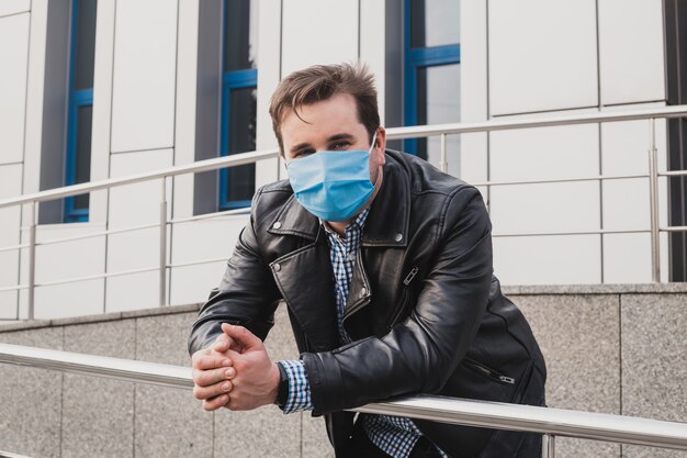 Young businessman on a closed office building