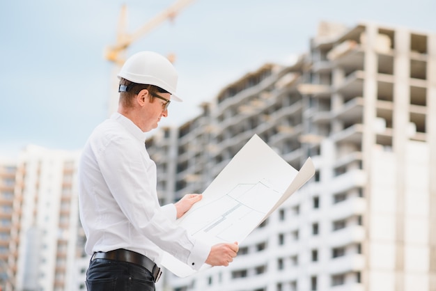 Young businessman construction site engineer,close up.