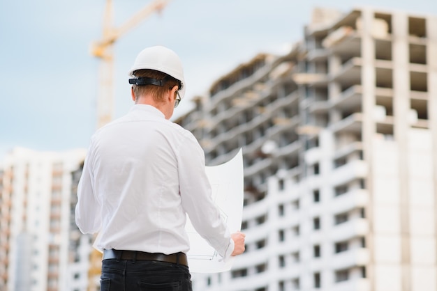 Young businessman construction site engineer,close up.