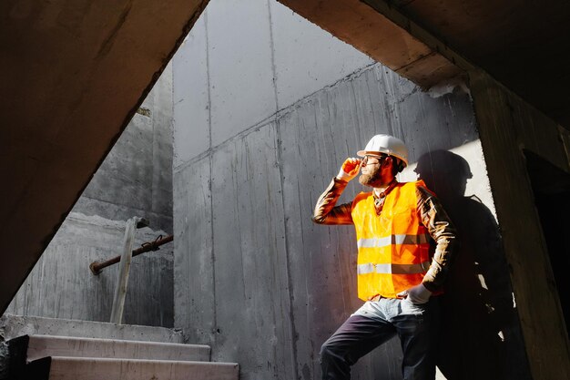 Young businessman construction standing on at his workplace on the construction site