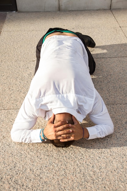 Young businessman depressed on the floor