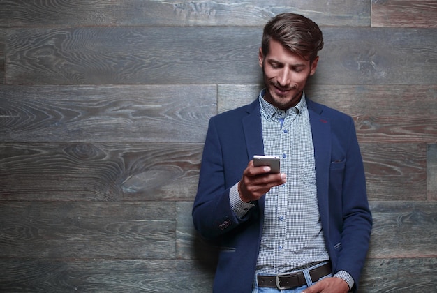 Young businessman dressed in a blue a jacket