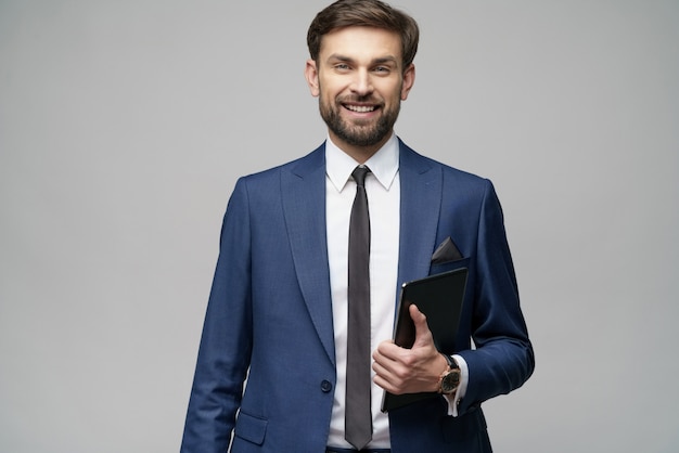 Young Businessman holding digital tablet pc pad with blank screen