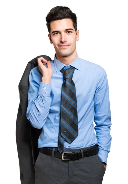 Young businessman holding his jacket isolated on white