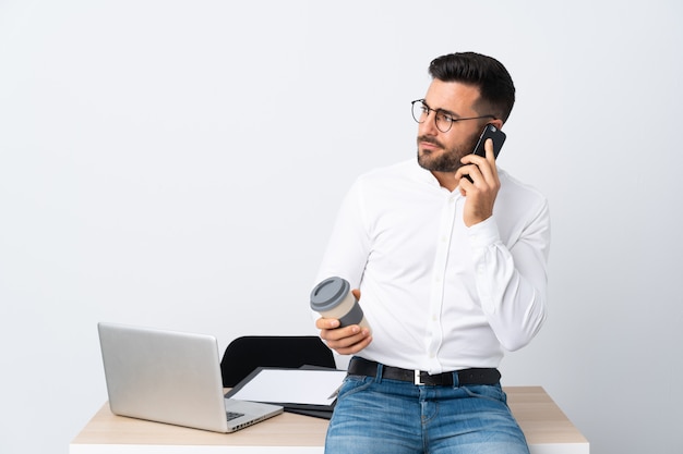 Young businessman holding a mobile phone