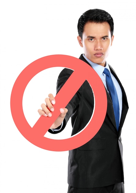 Photo young businessman holding prohibited sign