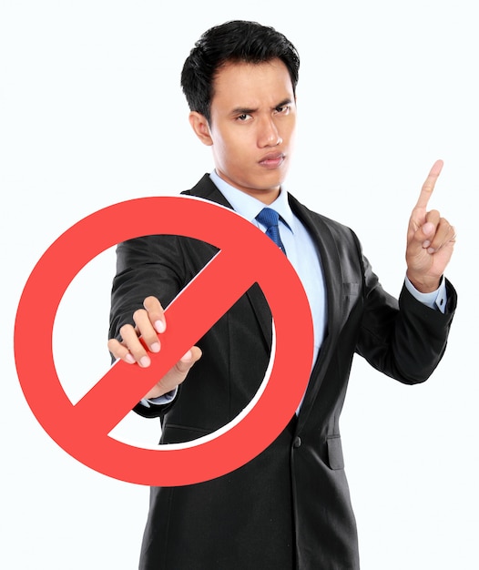 Photo young businessman holding prohibited sign