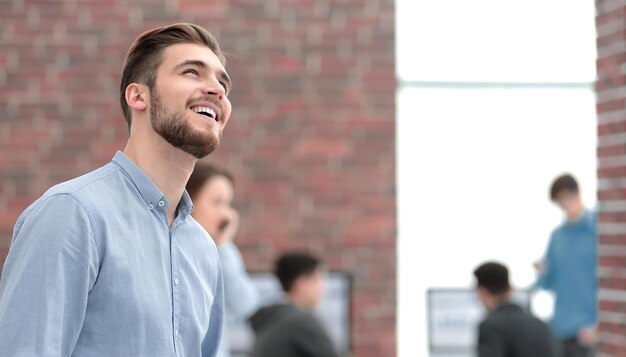 Young businessman looking away while working in the office