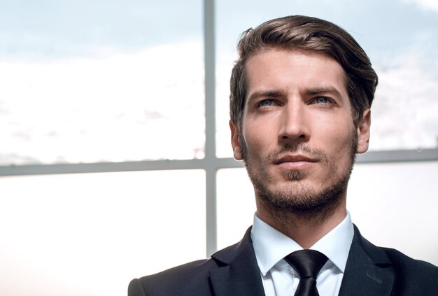 Young businessman looking forward confidently