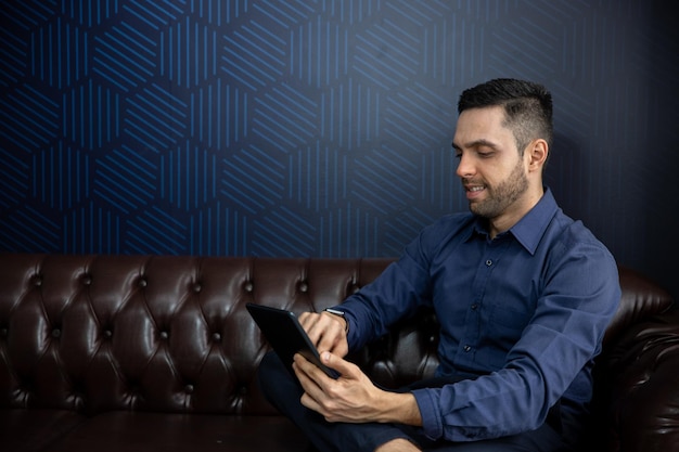 young businessman looking at tablet