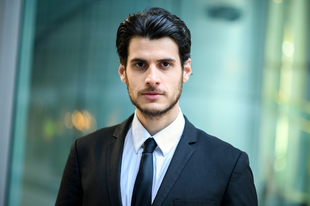 Young businessman outdoor in a serious expression