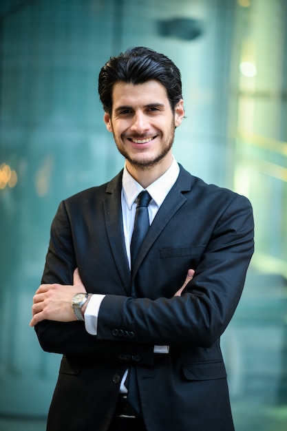 Young businessman outdoor smiling confidently