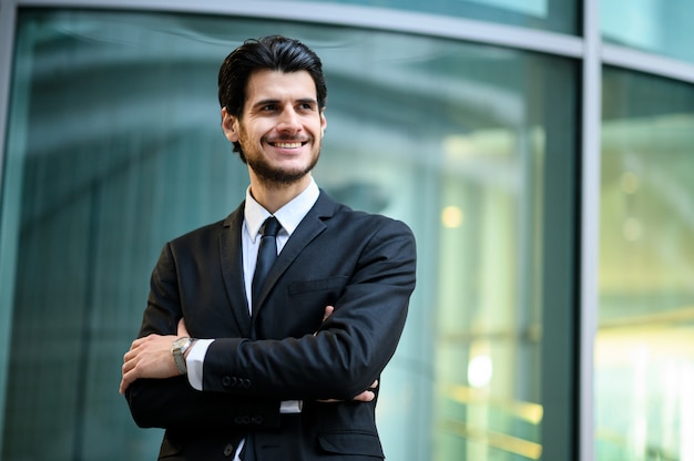 Young businessman outdoor smiling confidently