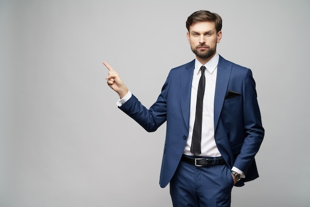 young businessman pointing with his finger