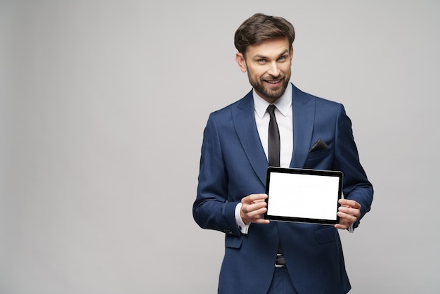 Young Businessman presenting digital tablet pc pad with blank screen