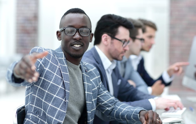 Young businessman reaching out for a handshake successful international business