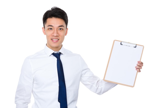 Young businessman show with blank page of clipboard