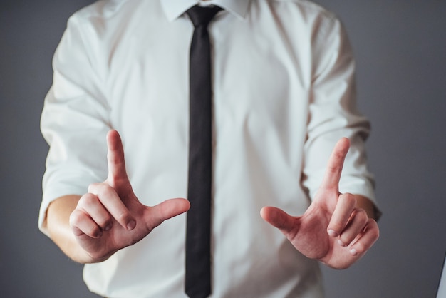 Young businessman showing empty hands