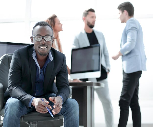 Young businessman sitting in the office