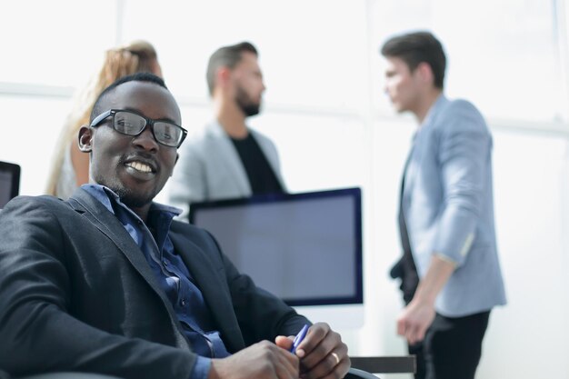 Young businessman sitting in the officephoto with copy space