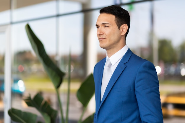 Young businessman standing confident outdoor