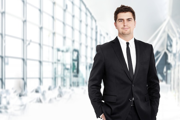 a young businessman standing over the of his modern office