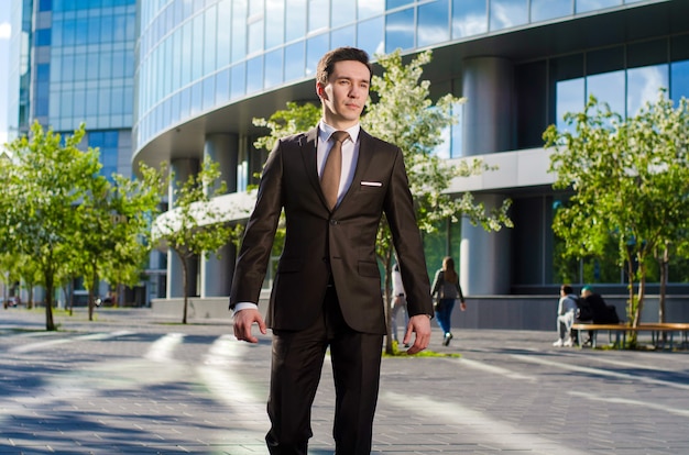 A young businessman in a summer metropolis.